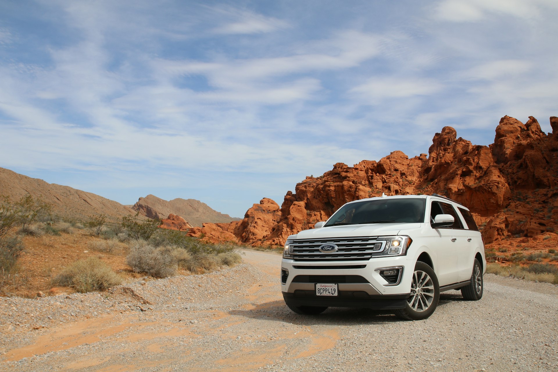 Rental SUV parked on a desert road