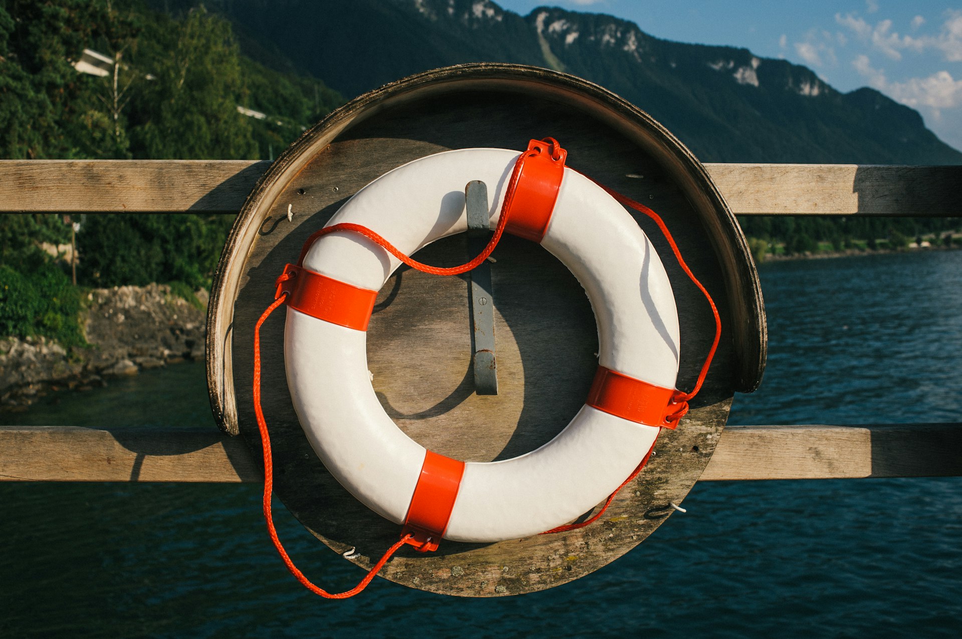 Life ring mounted on a scenic waterside railing